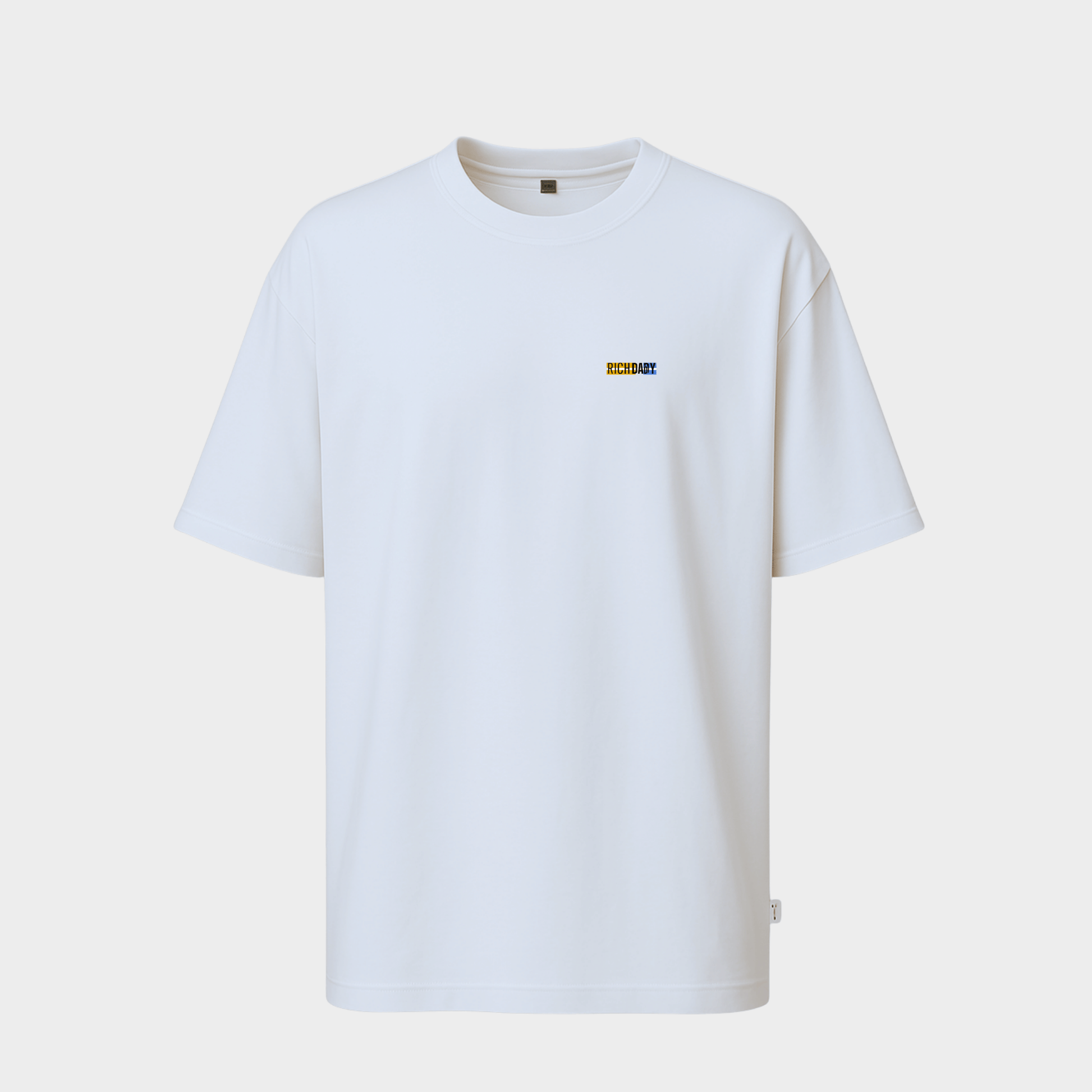 White t-shirt with a small logo on a light gray background