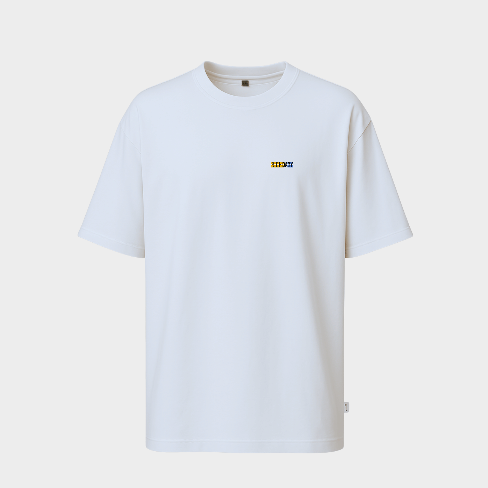 White t-shirt with a small logo on a light gray background